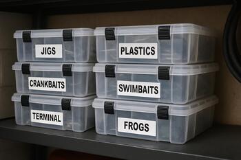 Labeled storage crates with ice gear stacked on a shelf