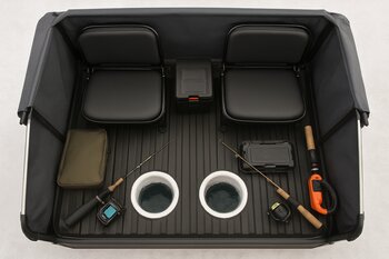 Top view layout of a larger ice shelter with cots and multiple holes